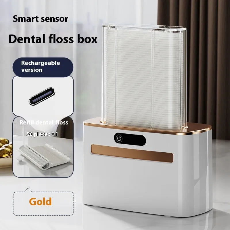 Dark grey automatic electric dental floss box with pop-up mechanism on a bathroom counter.