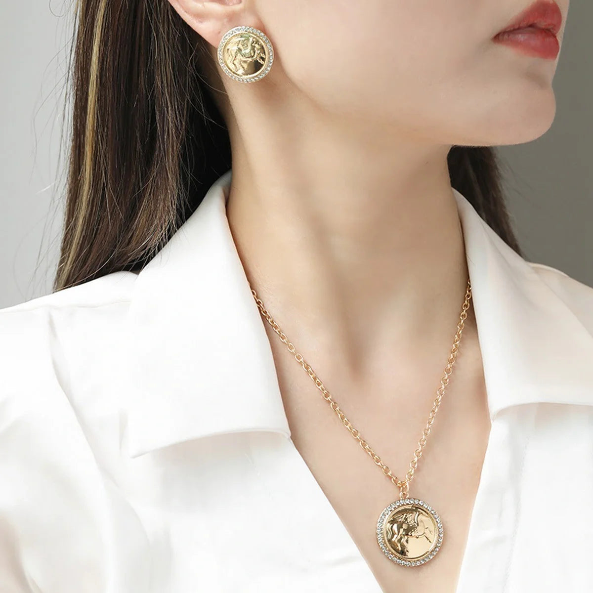 Intricate Pegasus coin pendant necklace and earrings set with classic O-chain design in alloy metal