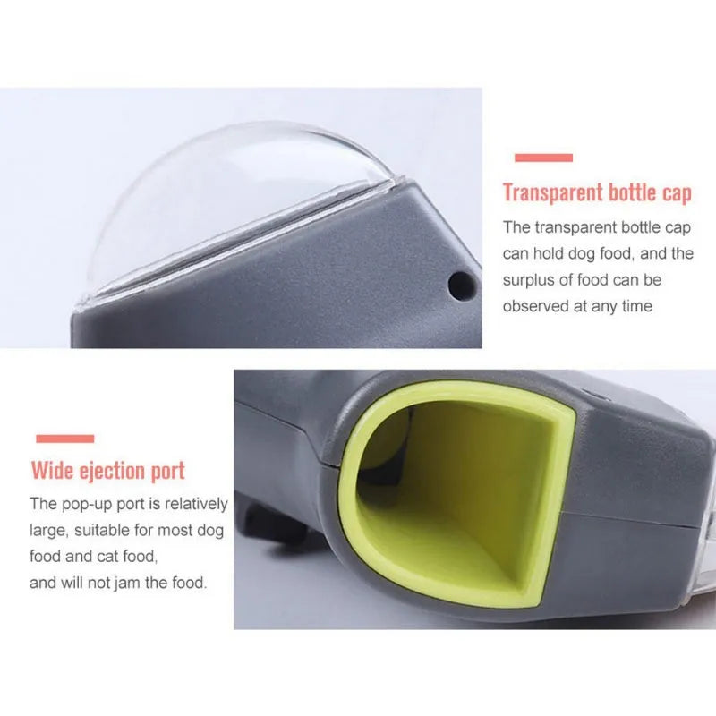 Grey plastic pet snack catapult launcher toy with ergonomic handle, shown with treats.