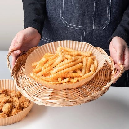 Disposable air fryer liners made of durable, food-grade parchment paper for effortless cleanup and healthy cooking