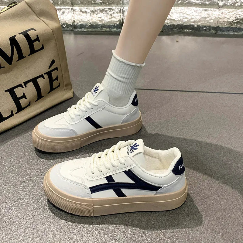 Blue and brown low-top casual sports shoes with round toe and flat rubber sole.