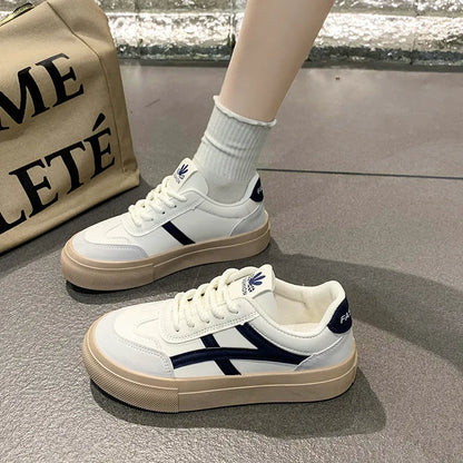 Blue and brown low-top casual sports shoes with round toe and flat rubber sole.