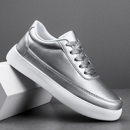 Women's lightweight leather flat casual shoes in gold colour with front lace-up design on a white background