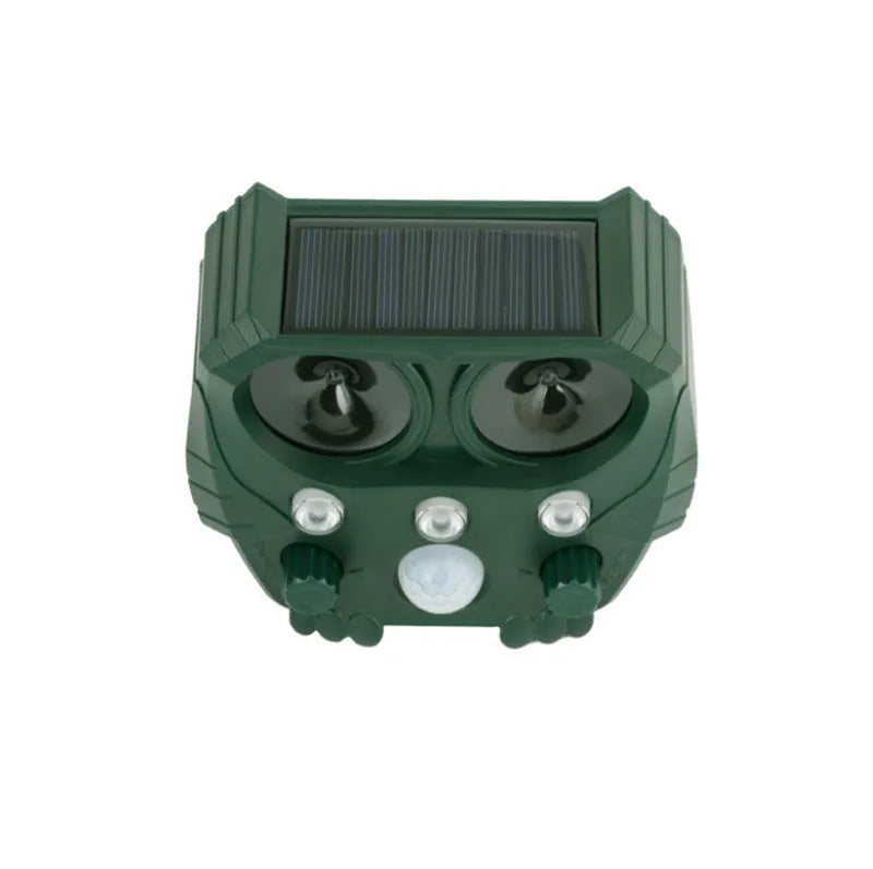 Green solar-powered ultrasonic dog and pest repeller unit for outdoor garden protection