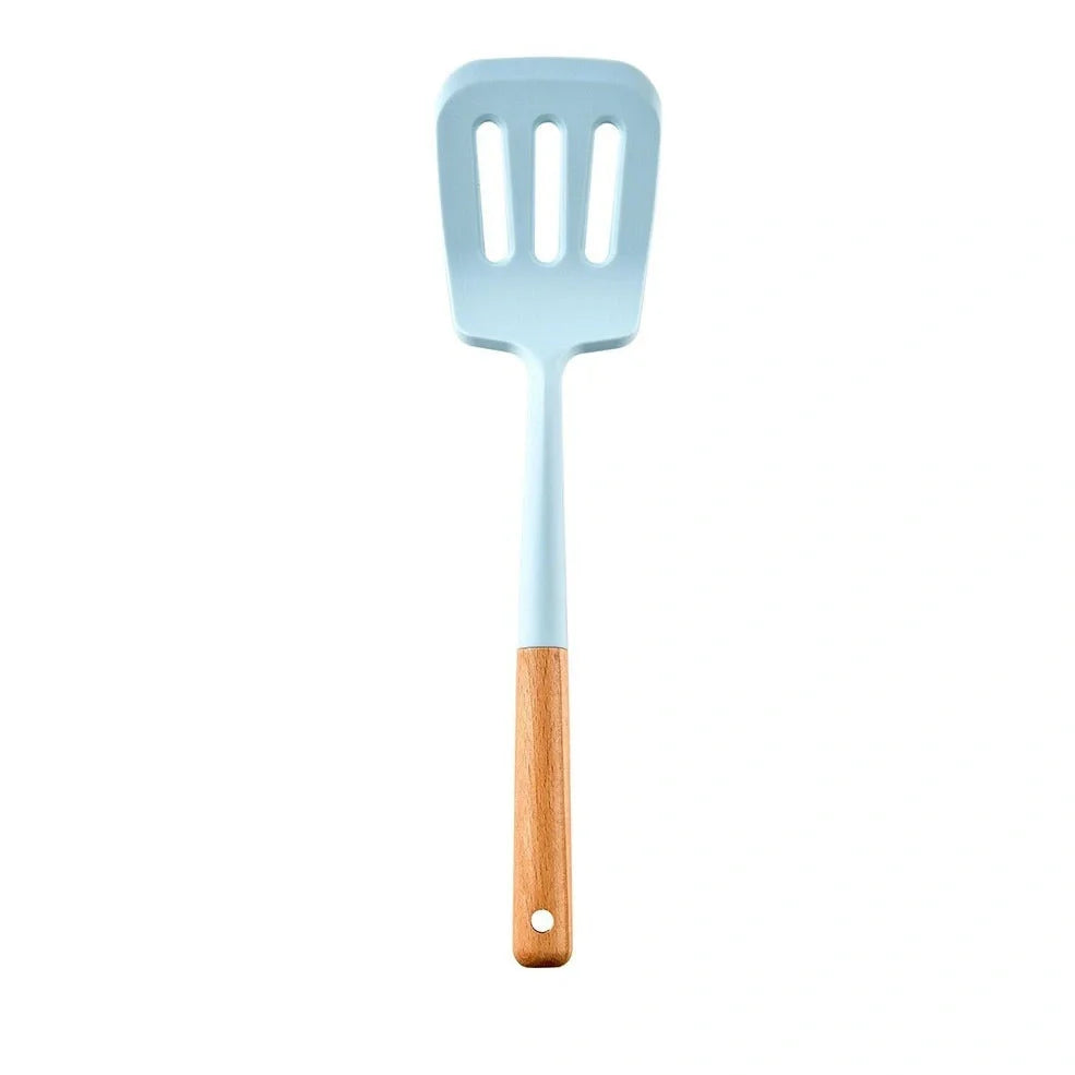 Blue silicone non-stick cookware set with frying spatula, colander, egg beater, and white iron storage bucket for kitchen organisation