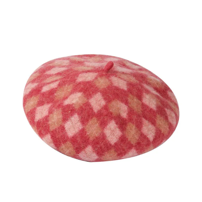 Wool plaid beret with dome crown, adjustable size, and tassel and mesh detail in blue light coffee plaid.