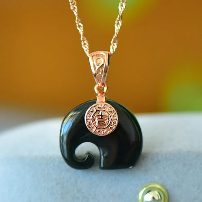 Flat grey Hetian Jade pendant with ink blue jade details and copper inlay on a necklace chain