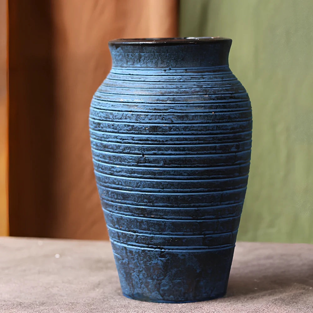 Ceramic mosaic vase with dried flowers, showing mosaic pattern and 25cm height