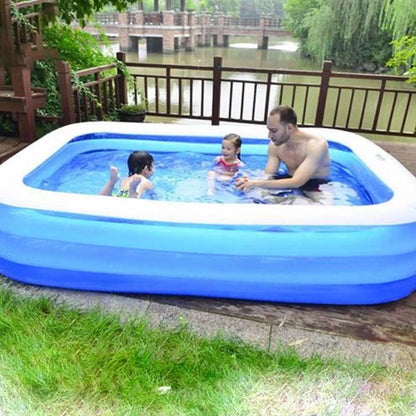 Large rectangular blue paddling pool measuring 200cm long × 150cm wide in garden setting