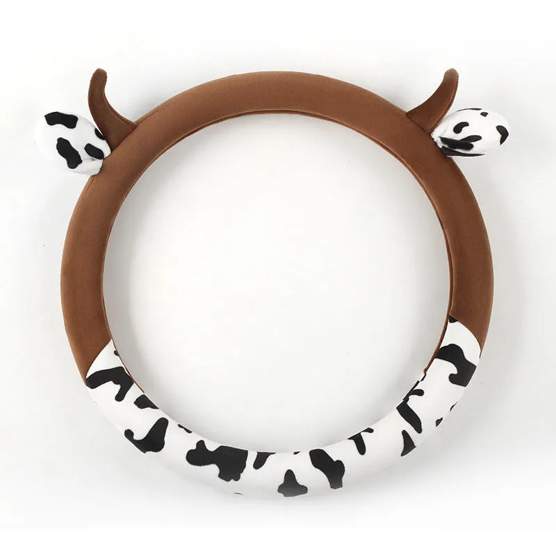 Short plush automotive steering wheel cover in black colour showing soft texture.