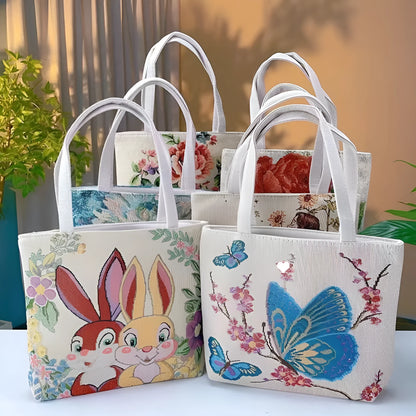 Colourful embroidered canvas shoulder bag with gold wire handles shown in small, medium, and large sizes.