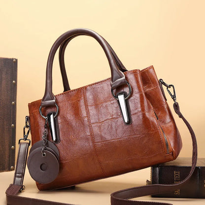 Retro contrast large capacity shoulder bag showing horizontal square shape and multiple internal compartments