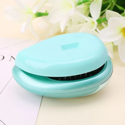 Portable vibrating hair massage comb with ionic technology for on-the-go hair rejuvenation and styling