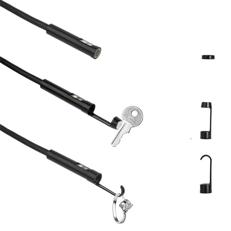 Wireless dual-lens inspection endoscope with IP68 waterproof probe, magnet, and hook accessories on a table.