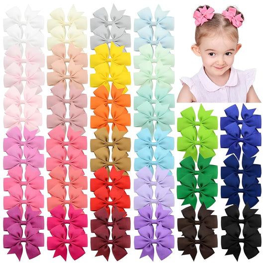Assortment of 3 inch grosgrain ribbon pinwheel hair bows on alligator clips for toddlers in multiple colours.