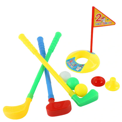Children's golf set with three clubs, three balls, putting hole with flag, and adjustable tees on green surface