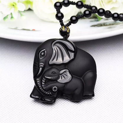 Hand-carved obsidian elephant pendant necklace with stretch bead chain for wealth and protection