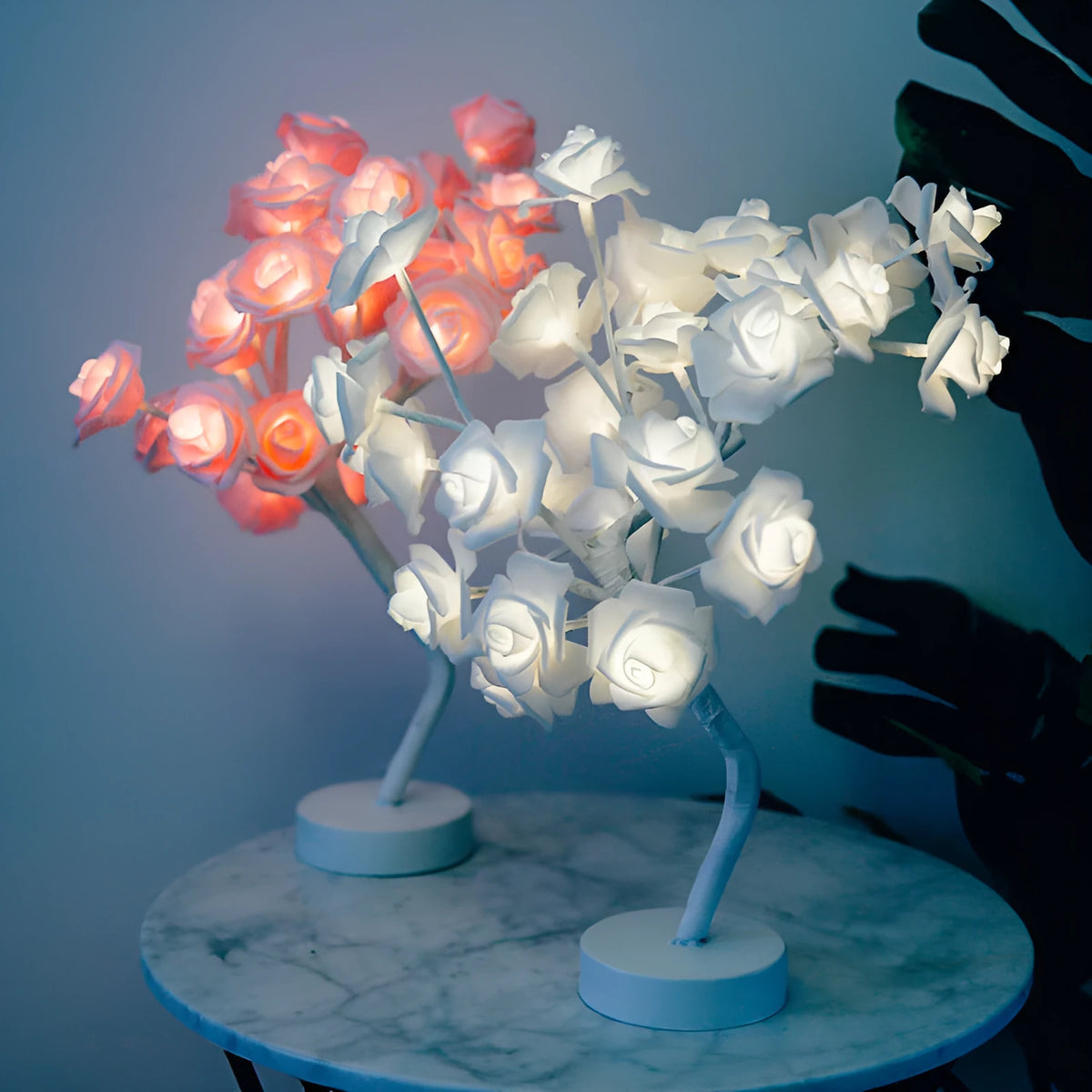 White and red rose flower LED lamp on a bonsai tree stand with warm white lights.