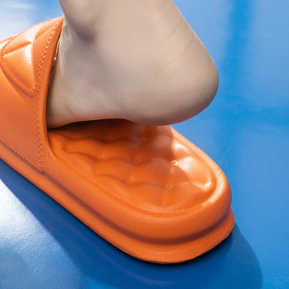 A pair of thick-soled EVA bathroom slippers in a selected colour, showing their injection-moulded non-slip design.
