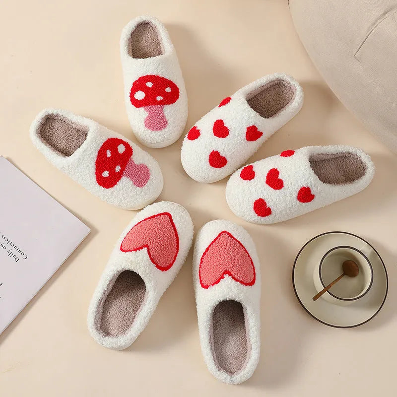 Women's plush home slippers in cartoon designs with a non-slip PVC sole.