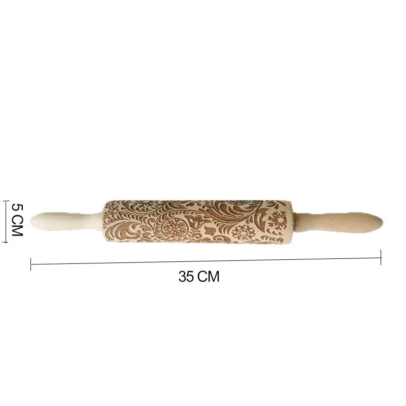 Wooden rolling pin with engraved Christmas patterns including reindeer and snowflakes on a 45cm long barrel.