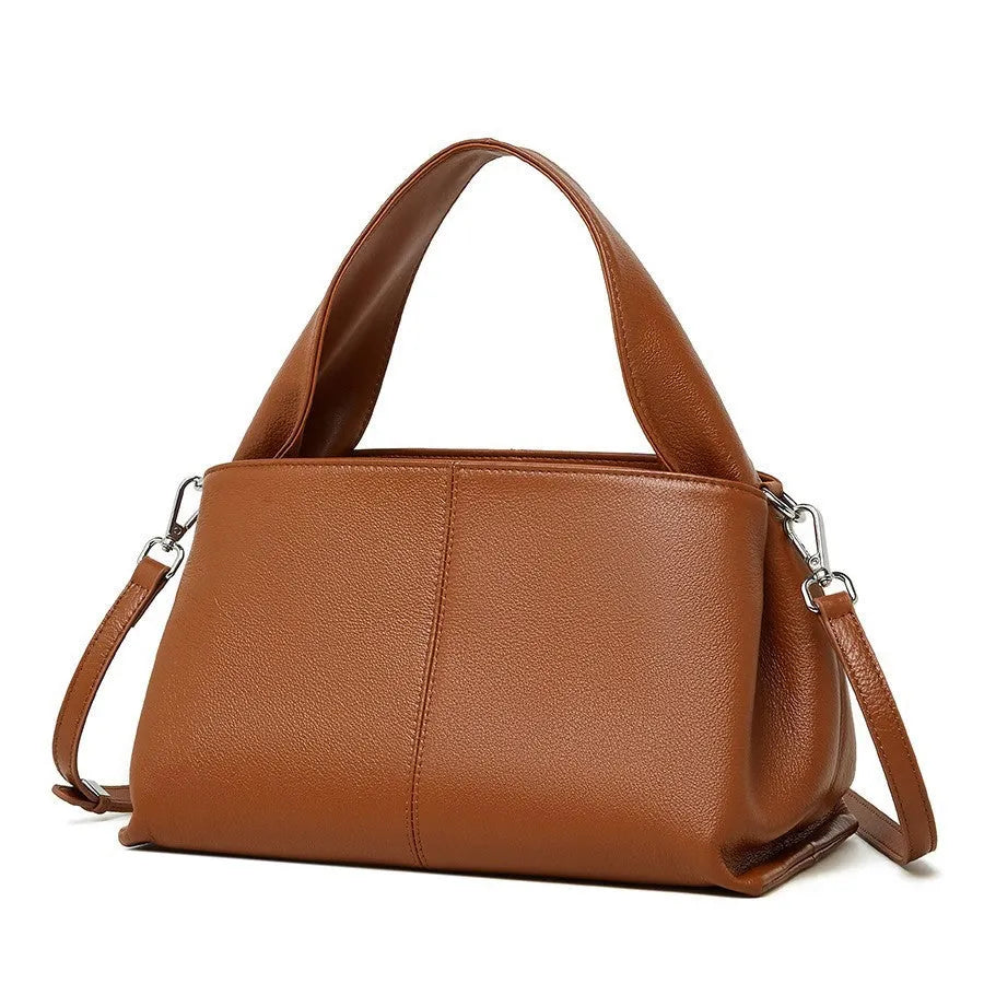 Women's genuine cowhide retro texture messenger bag in horizontal square shape, shown in apricot colour with double shoulder straps.