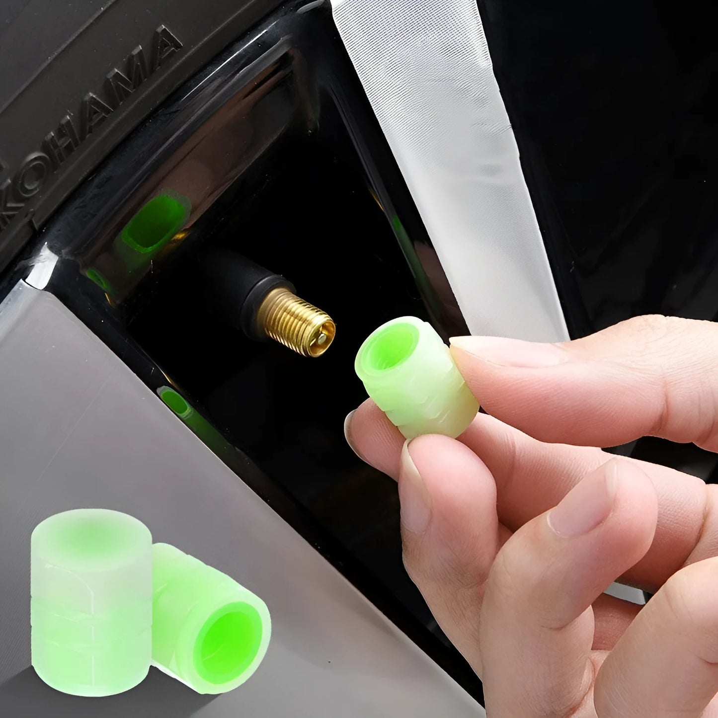 Set of four luminous rubber valve caps for car tyres showing glow effect