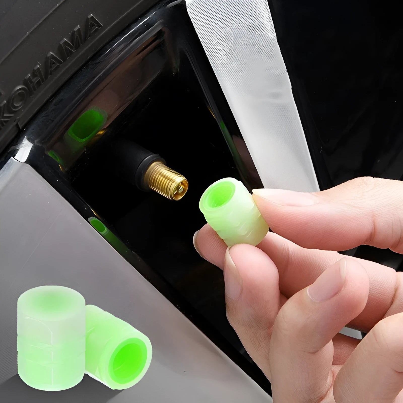 Set of four luminous rubber valve caps for car tyres showing glow effect
