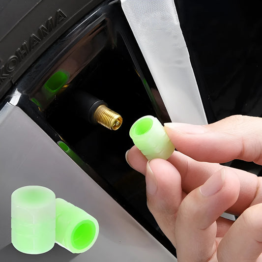 Set of four luminous rubber valve caps for car tyres showing glow effect