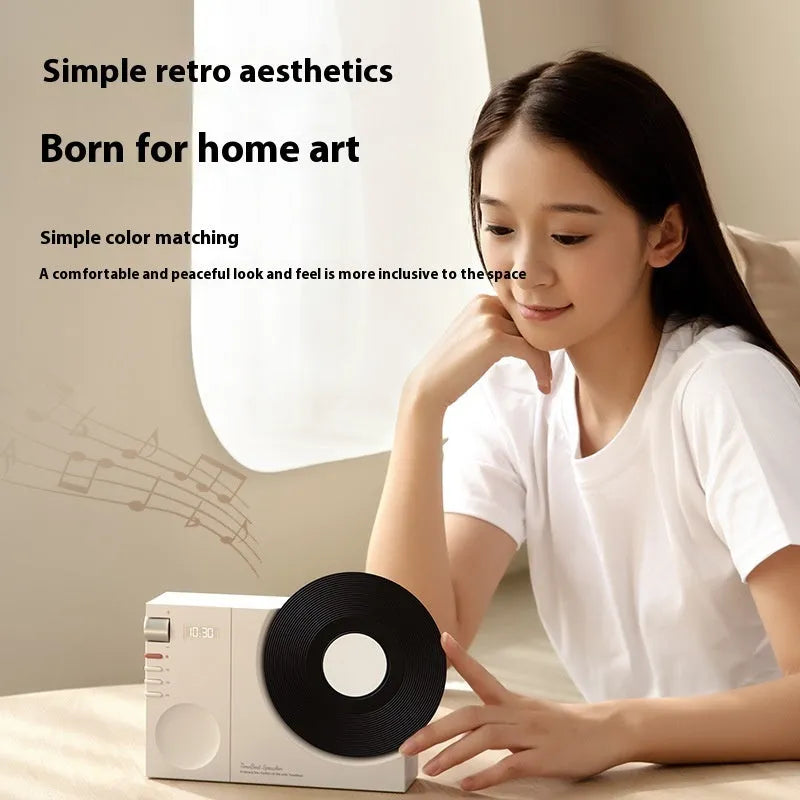 Mini Bluetooth speaker in obsidian black, showing compact design and USB port for charging.