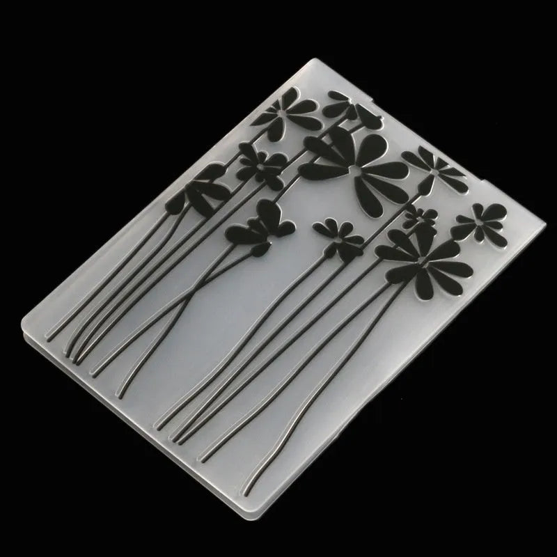 Set of ten plastic cake decorative moulds showing windmill, star, flower, and butterfly patterns.