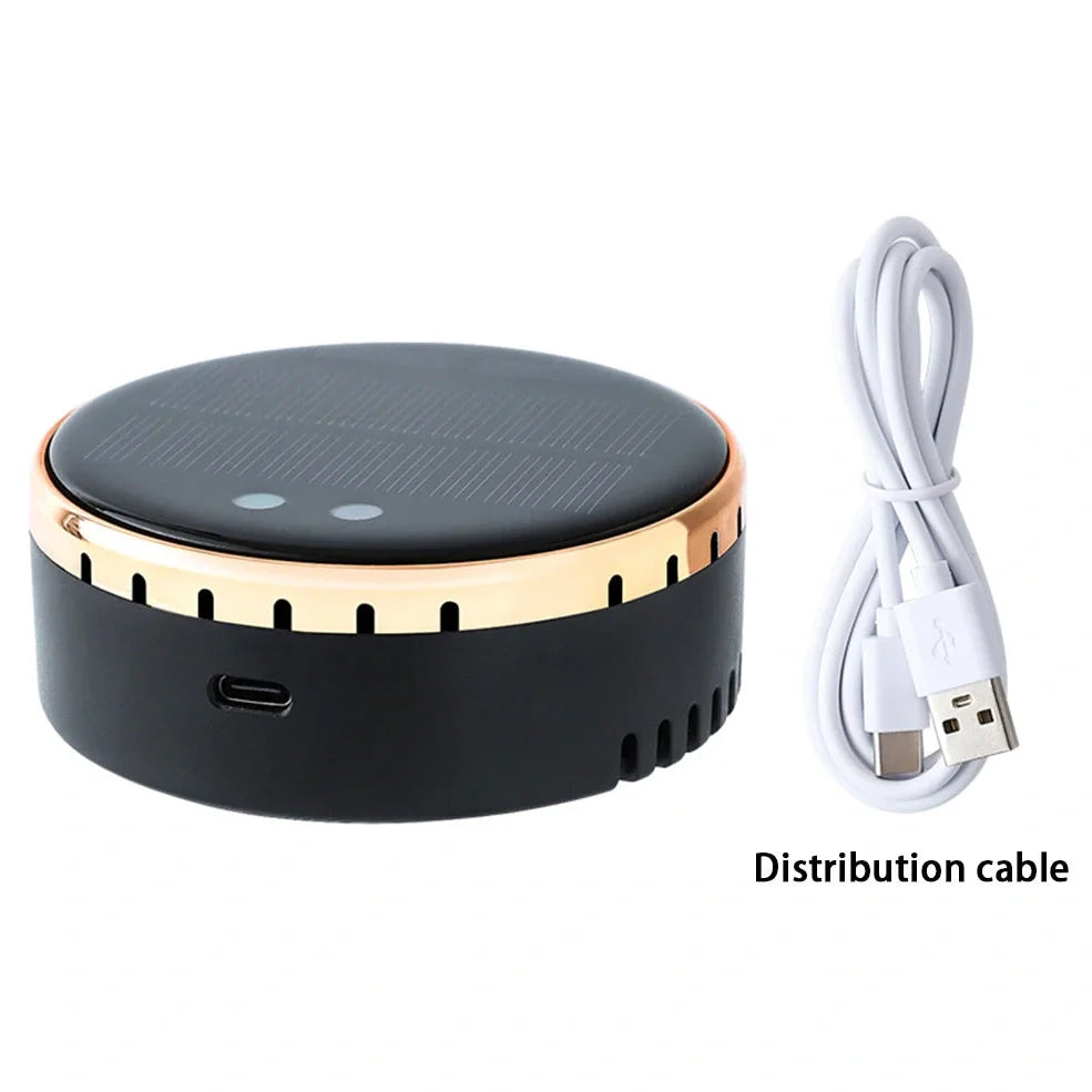 Black solar-powered car humidifier mounted on air conditioning vent with water mist visible