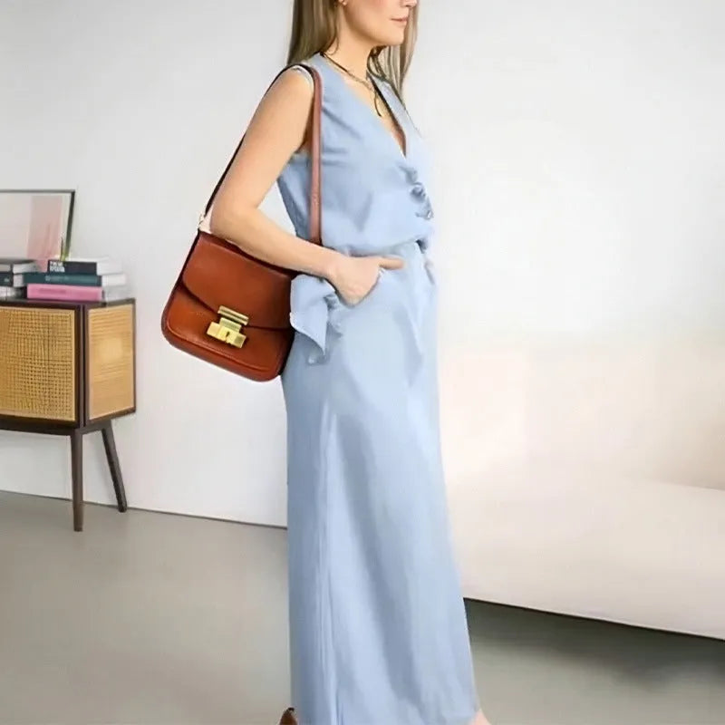 Women's casual two-piece suit with sleeveless vest and long skirt in blue colour, showing loose fit design