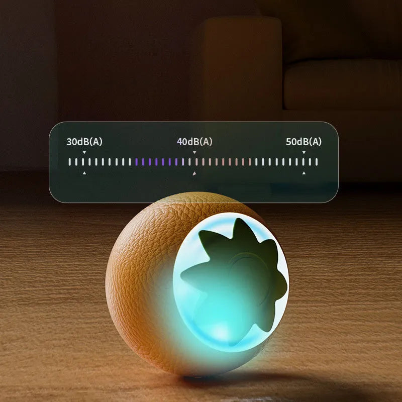 Green automatic rotating ball pet toy for dogs and cats on indoor flooring