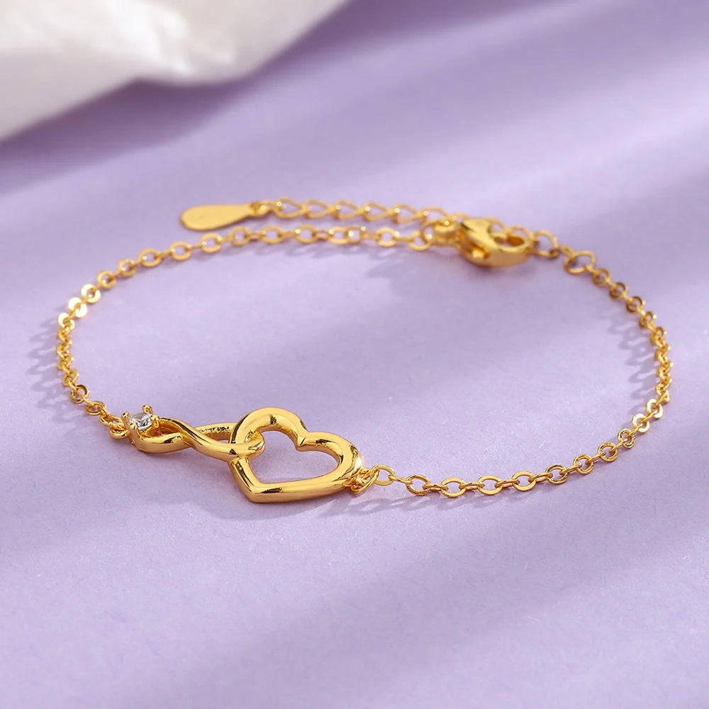 Heart-shaped bracelet with 3A zirconia in platinum and golden colors