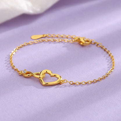 Heart-shaped bracelet with 3A zirconia in platinum and golden colors
