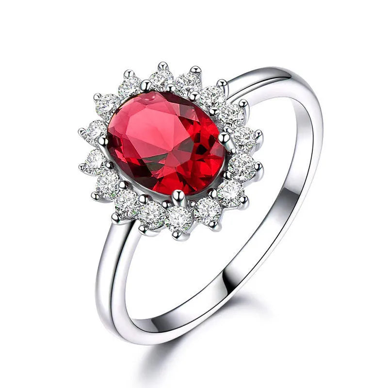 A women's copper ring with a flower design and a central zirconium stone, shown in green, blue, and red colour options.