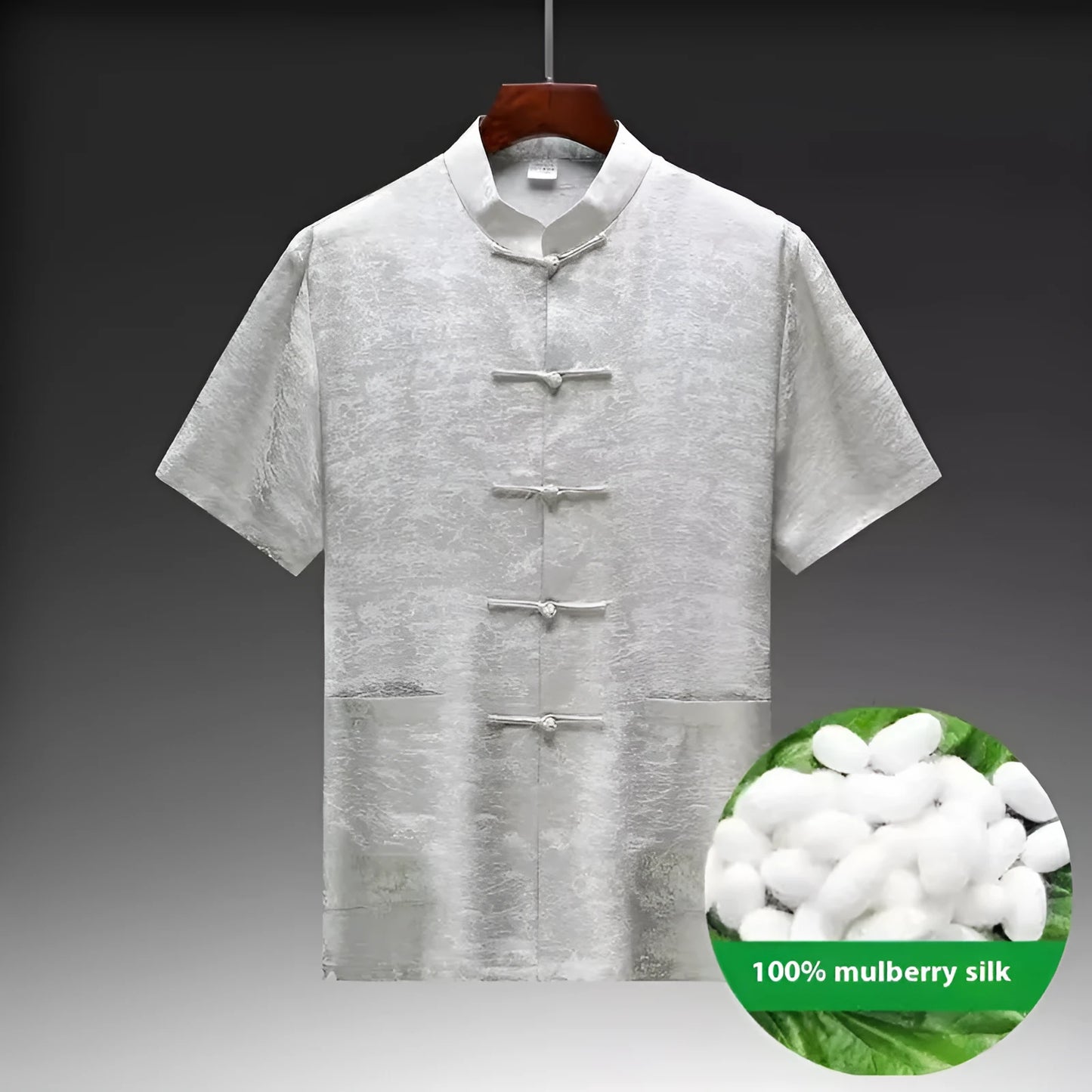 Traditional light green mulberry silk Tang suit for men on a hanger.