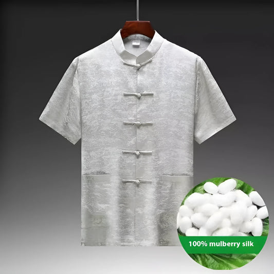 Traditional light green mulberry silk Tang suit for men on a hanger.