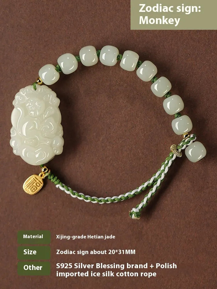 Hetian jade bracelet with a rabbit zodiac charm and S925 silver card on a red ice cotton rope.