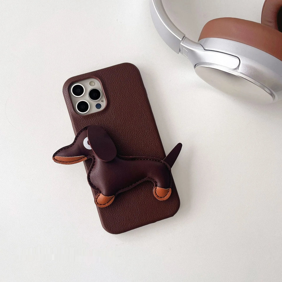 Leather sausage dog iPhone case with embossed 3D dachshund design in brown, all-inclusive anti-fall cover