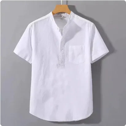 Man wearing a beige loose-fit linen blend casual shirt with a stand collar and short sleeves.