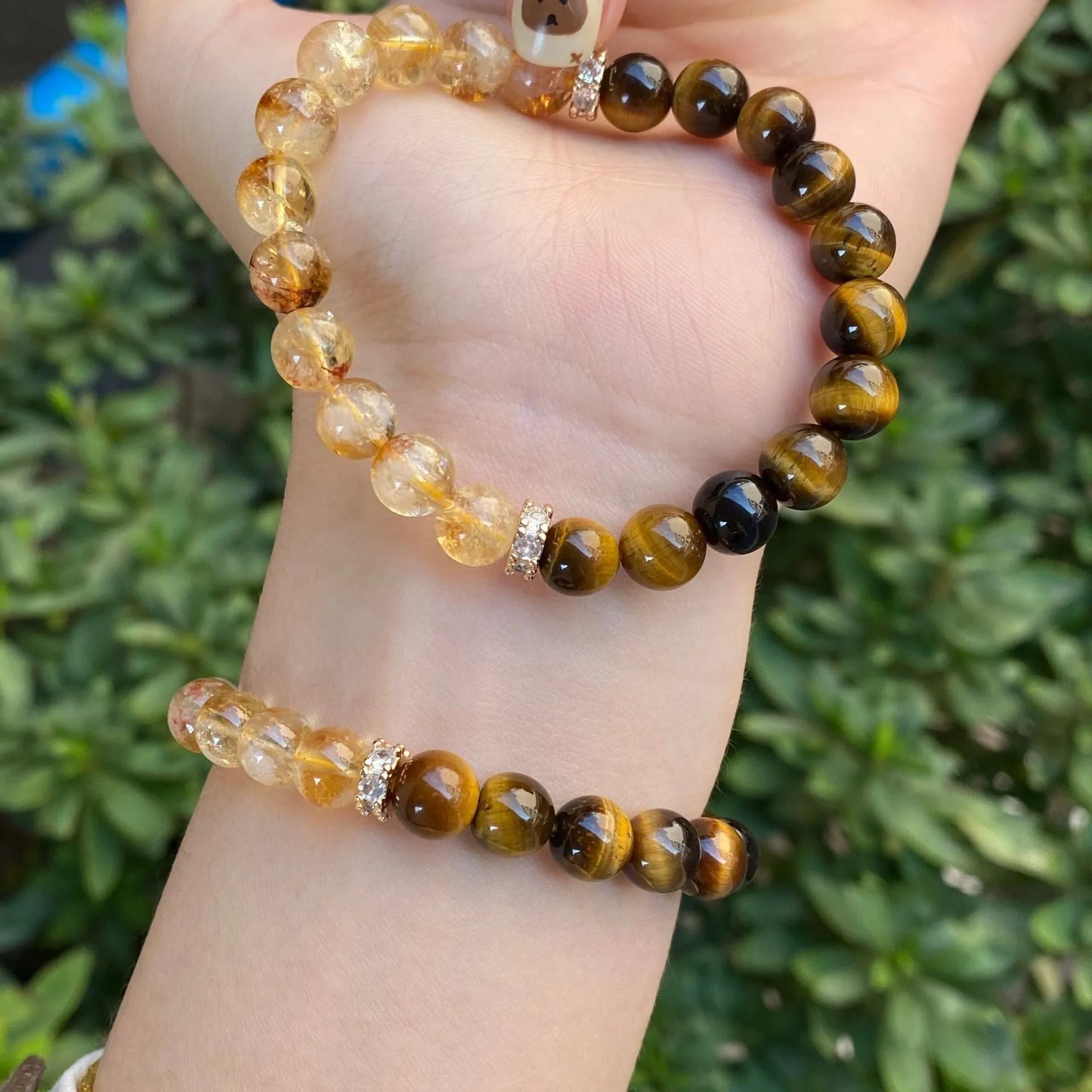 Handmade crystal bracelet with diamond gourd, disc, and prayer wheel beads in 8mm and 10mm sizes.