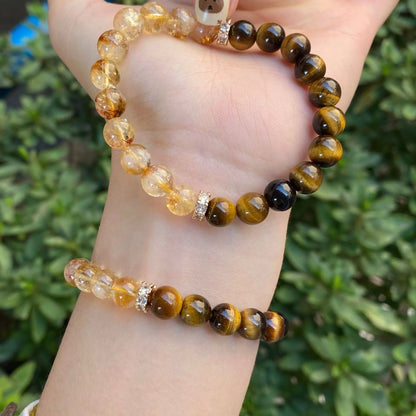 Handmade crystal bracelet with diamond gourd, disc, and prayer wheel beads in 8mm and 10mm sizes.