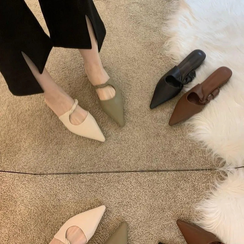 Women's soft leather slippers with semi-toe box in black, khaki, cream-white, and dark brown colours on a rubber sole.