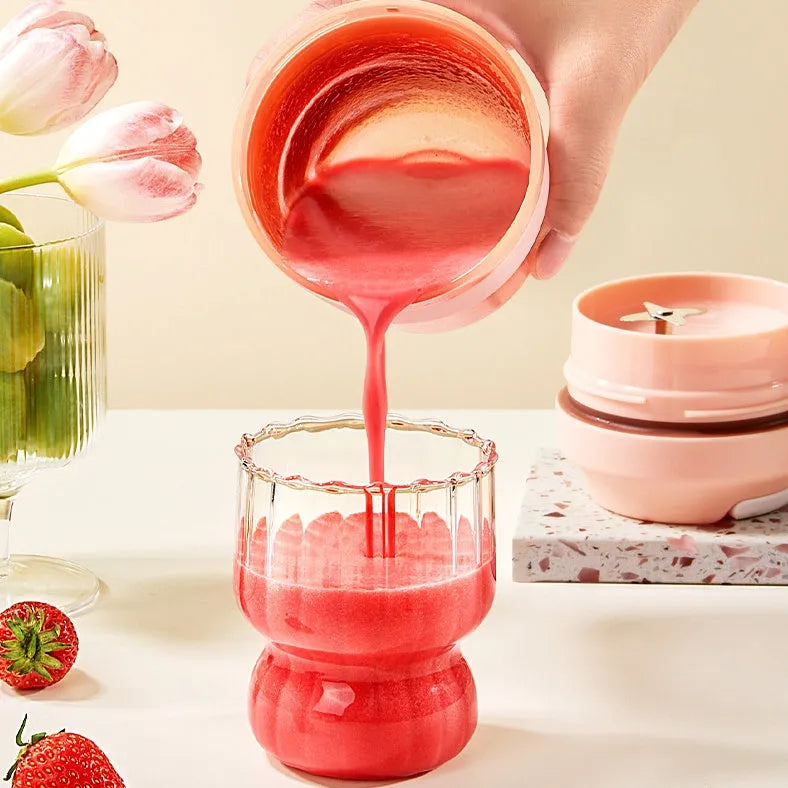 Green portable USB rechargeable blender cup with lid and four stainless steel blades, 400ml capacity.