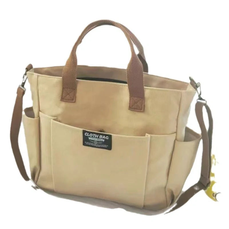 Large Capacity Shoulder Canvas Bag in khaki, black, and beige with three-dimensional pocket