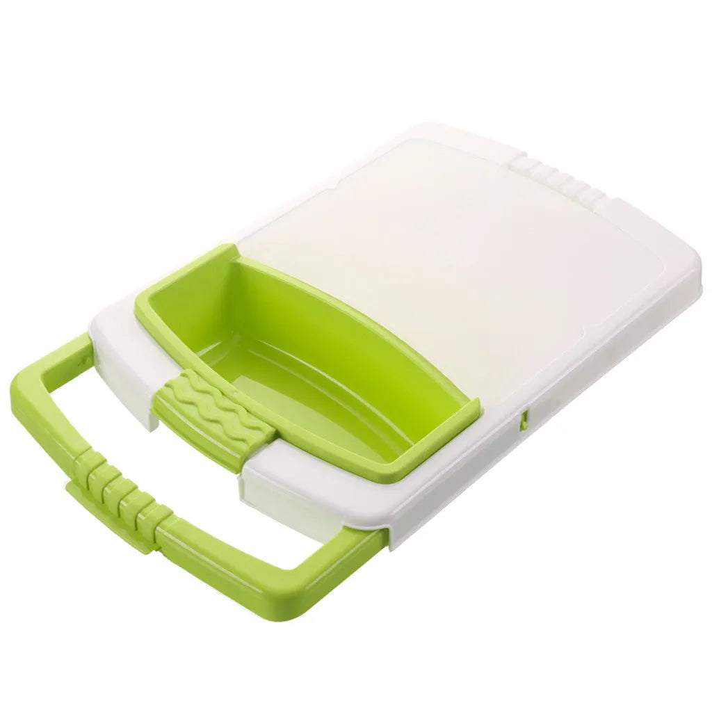 Green multifunction cutting board with drainage holes and storage trough mounted on a kitchen sink.