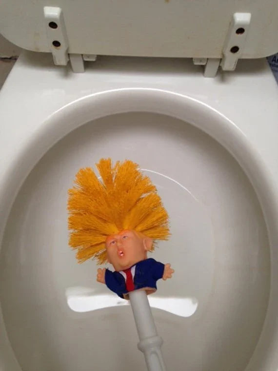 Comical Donald Trump-themed toilet brush made of durable plastic with a bold yellow color and convenient hanging slot