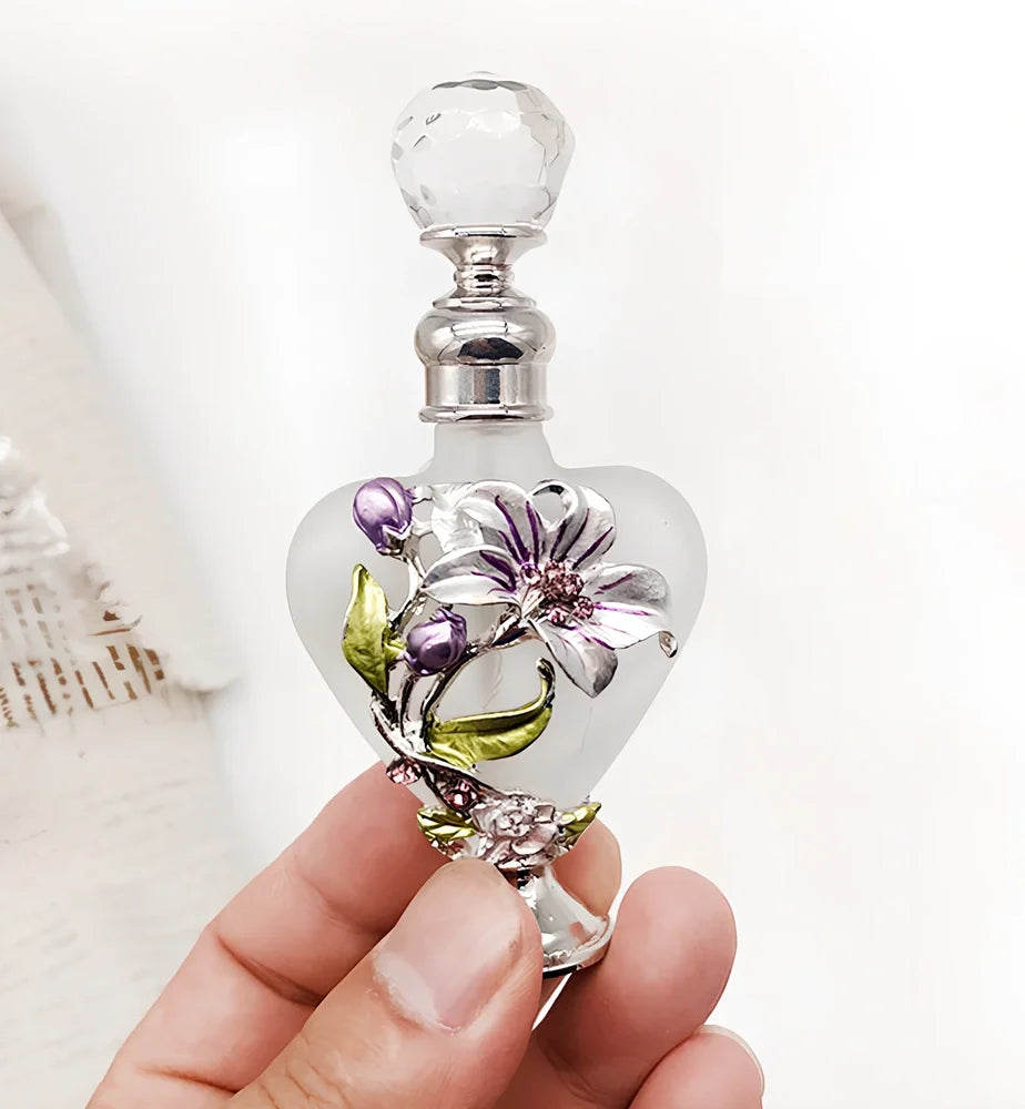 Heart-shaped refillable perfume bottle with metal and crystal construction, 3.6 inches tall